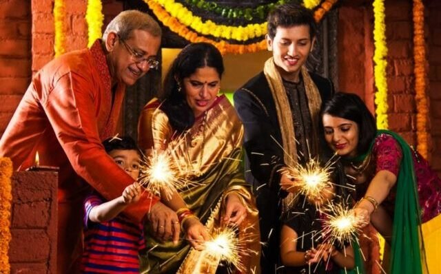 family using fuljhari and chakri on diwali