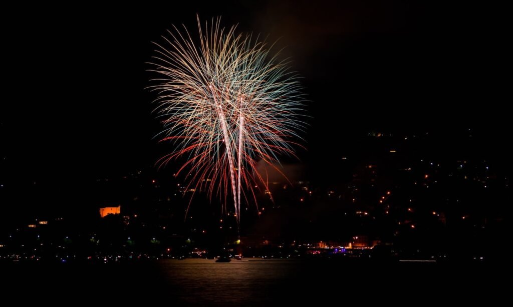high altitude single shot rocket fireworks display at outdoor event 