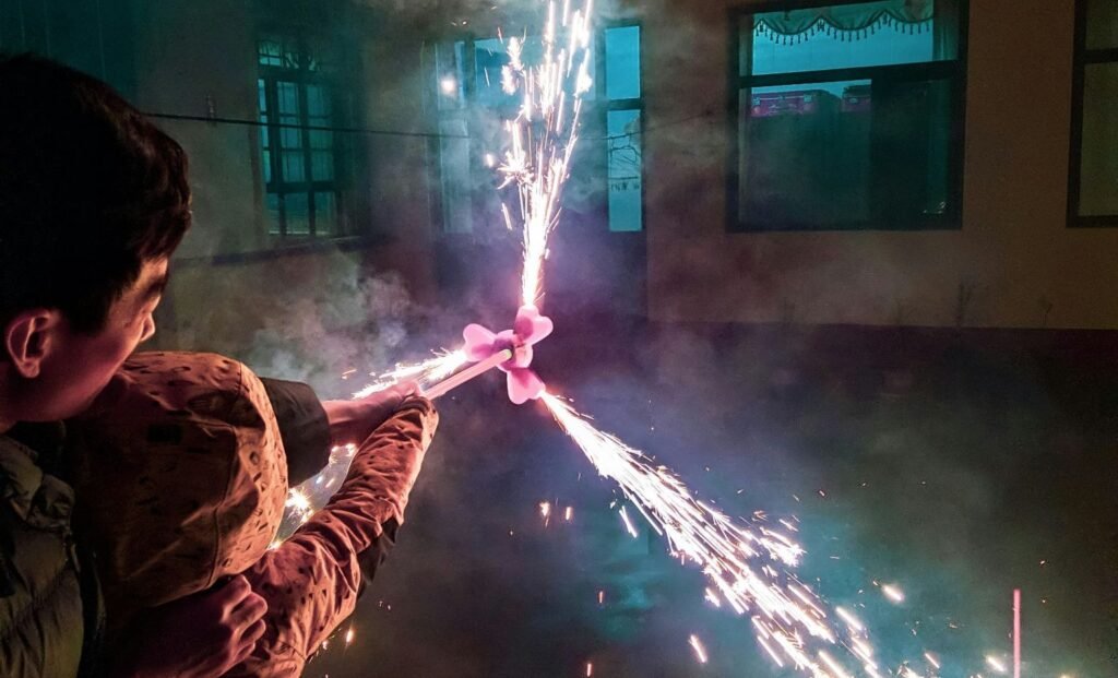 parent and child enjoying fireworks