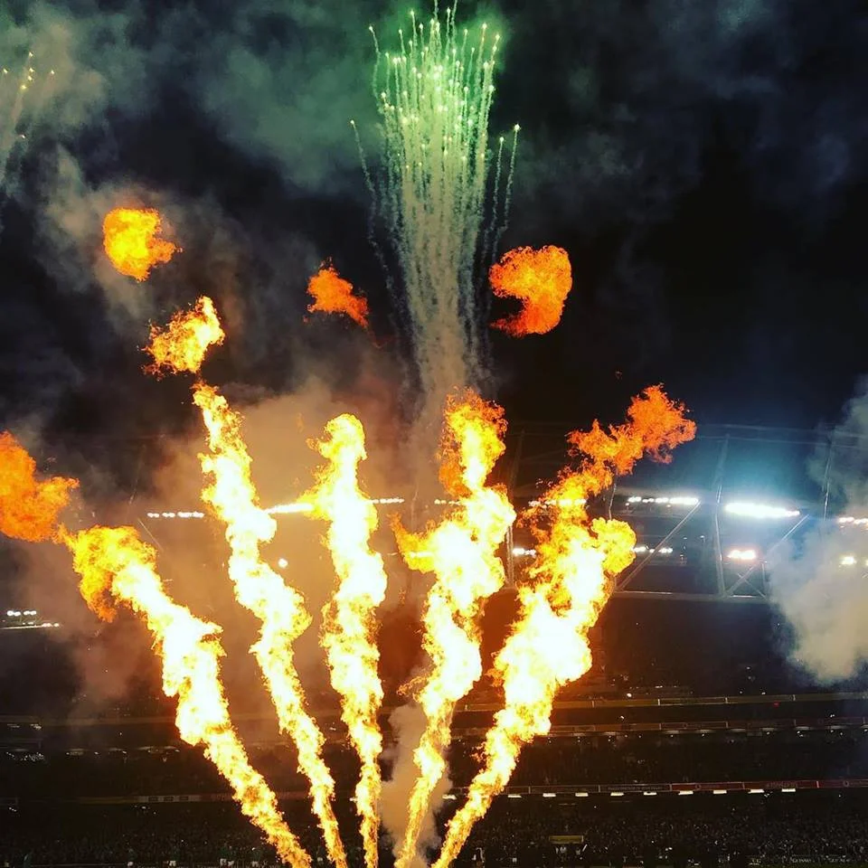 Motion lighting & SFX for events featuring synchronized flame jets and colorful smoke bursts creating a dramatic stage effect